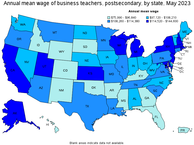 Map of annual mean wages of business teachers, postsecondary by state, May 2023