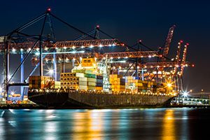 Cargo ship in port at night