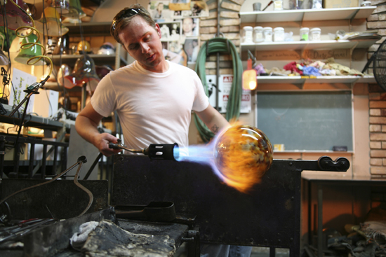 A glassblower at work.