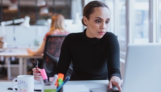 Woman working at a computer