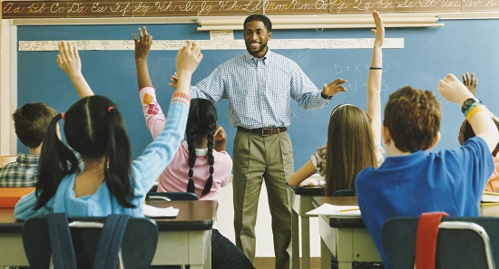 Teacher with students raising their hands