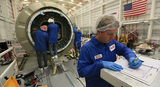 Technician working with engineers