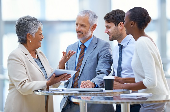 Workers of varied ages in a meeting