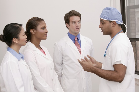 Surgeon talking to interns