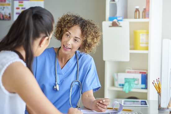 Nurse speaking to patient