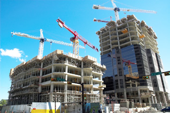 Cranes over partially constructed buildings