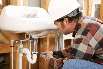 Man installing a sink