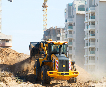 Bulldozer moving dirt at a construction site