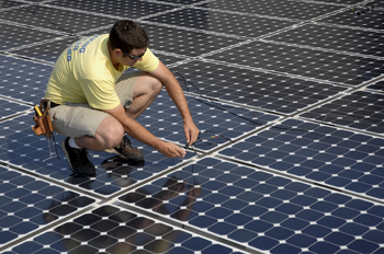 Illustation 8. Man wiring solar panels