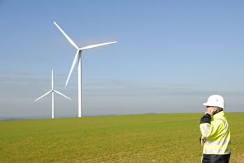 Worker on phone at wind farm