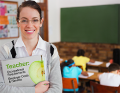 Female teacher in a classroom holding a book