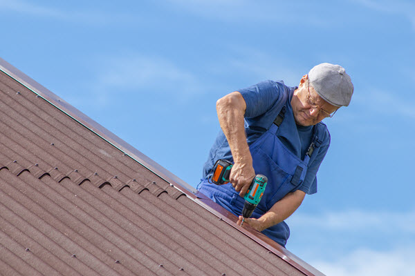 Worker located on a roof making a repair