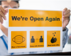 Open Again sign in shop window