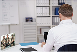 Gulf war veteran sitting at desk at work, feauture image for aticle