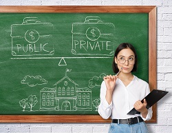 Teacher standing in front of chalkboard