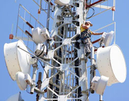 Worker on satellite tower