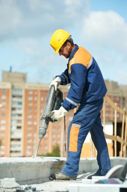 Worker using jack hammer