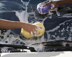 People washing a car