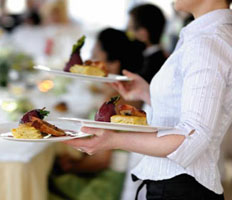 Waitress carrying plates of food