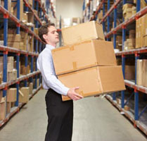 Man carrying boxes in a warehouse