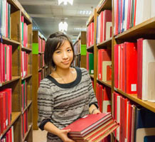 Worker shelving books