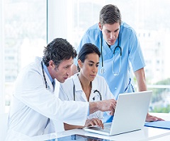 Workers talking to hospital patient