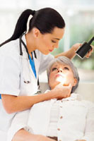 Health care worker examining patient