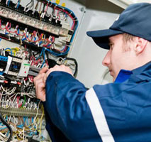 Worker repairing electrical circuits