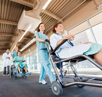 Nurse pushing patient in wheelchair