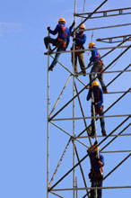 Workers on tower scaffolding