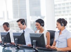 Workers sitting at computer terminals