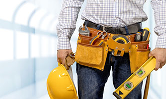 construction worker wearing tool belt around waist to carry tools