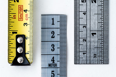 Sections of three rulers on a white background.