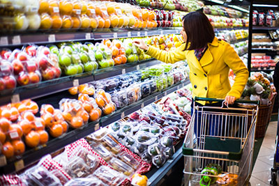 Woman picking out groceries and fresh produce