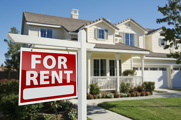 House with For Rent sign in front of it