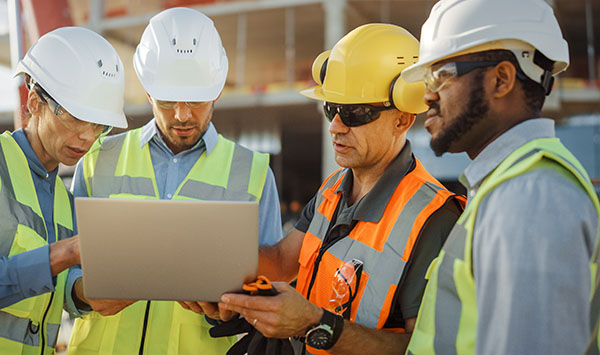 Construction workers meeting at a building site